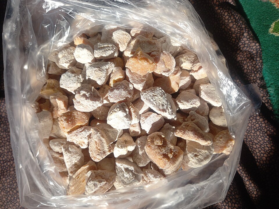 Dry solid kashk pieces in a clear bag